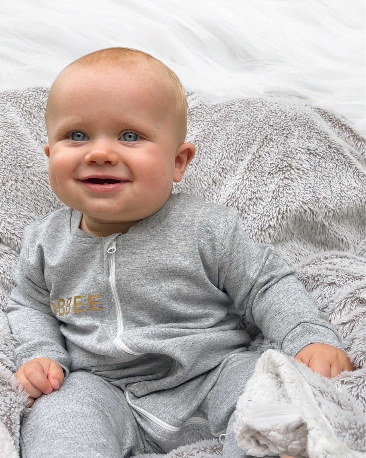 Luxurious Babywear: Grey Romper with Gold Embellishments