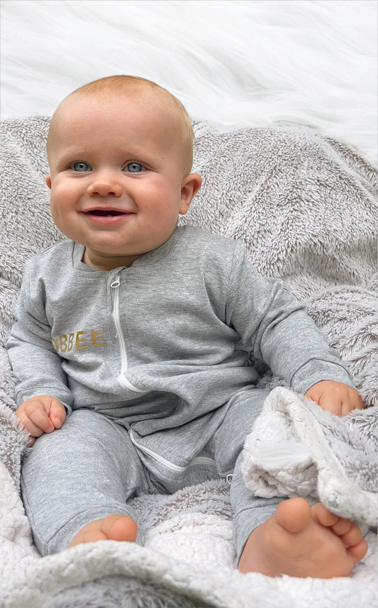 Luxurious Babywear: Grey Romper with Gold Embellishments