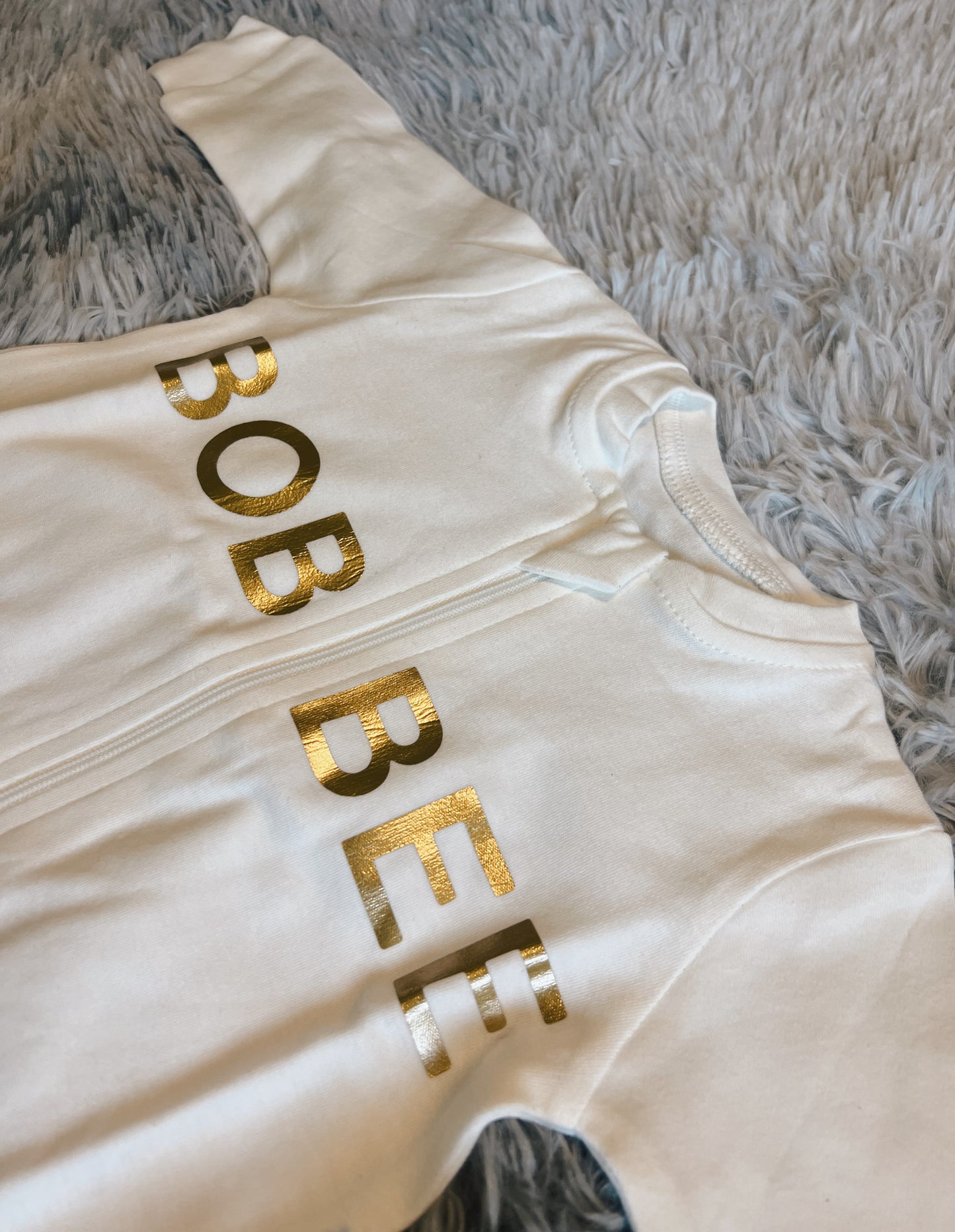 Timeless Elegance: White Baby Romper with Gold Details